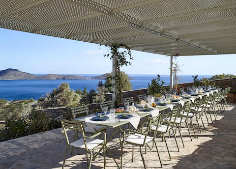 Dine out on one of the home's terraces and gaze out at Mirabello Bay