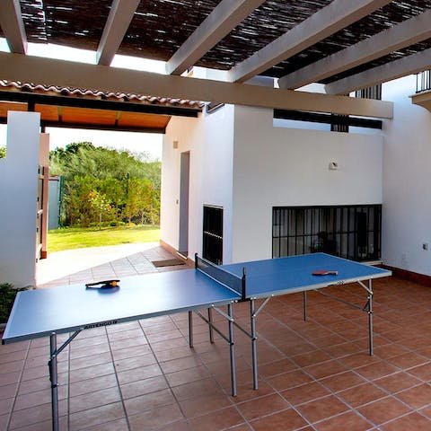 Play a few games of ping pong under the shade of the pergola