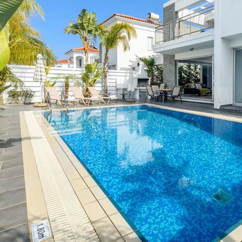 Soak in the gorgeous outdoor pool, or relax in a poolside lounger
