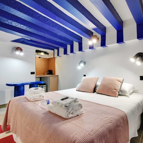 Drift off to sleep under the blue beams after exploring Paris