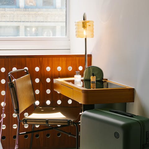 Work from home at the small desk if you're in town on business