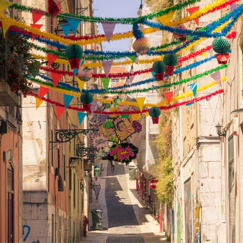 Head to the nearby neighbourhood of Bairro Alto and explore colourful streets