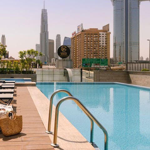 Swim laps in the communal pool while enjoying glorious views of the Burj Khalifa in the distance
