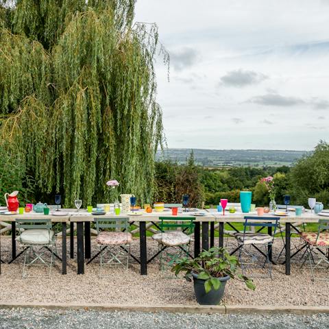 Set up the outdoor dining spot for a special meal with views across the valley