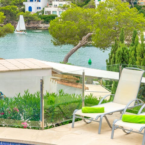 Sunbathe while watching the sail boats pass by from the elevated terrace 