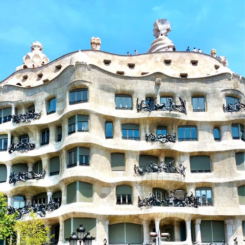 Take a five-minute stroll to Casa Milà and head up to its iconic roof terrace