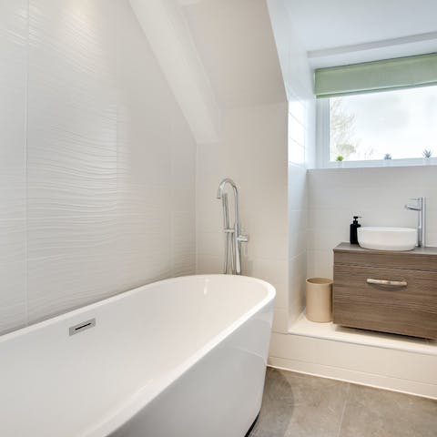 Take time to relax in the freestanding bathtub
