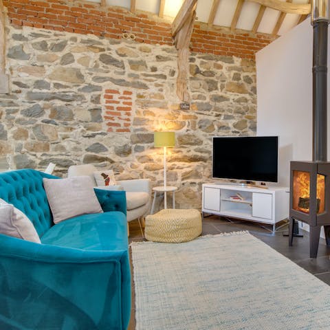 Snuggle up for a cosy evening of movies by the warmth of the fire 
