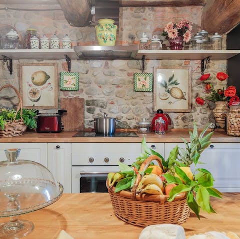Hire a chef to cook a delicious meal in the rustic kitchen