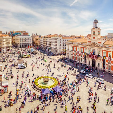 Visit bustling Puerta del Sol, seven minutes away on foot