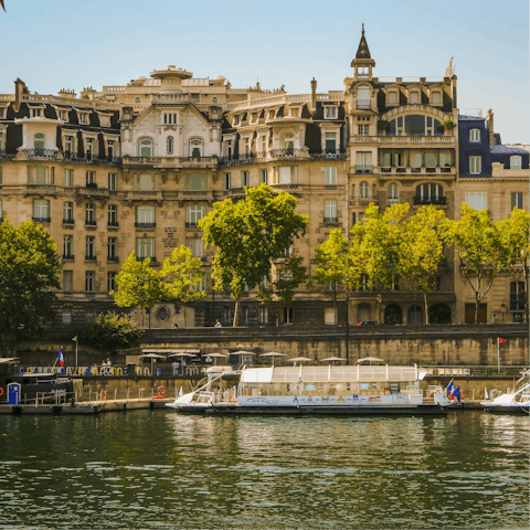 Enjoy a leisurely afternoon stroll alongside the Seine
