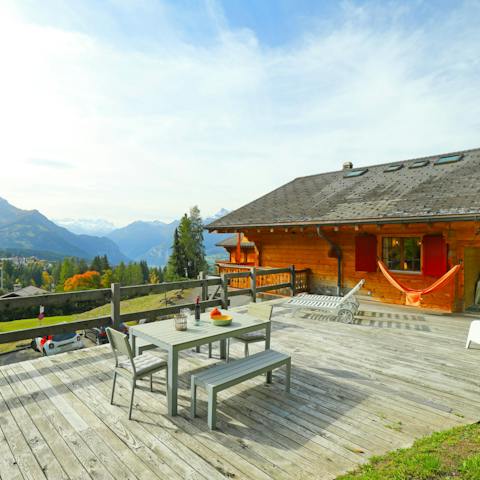 Soak up the sun and mountain views on the terrace