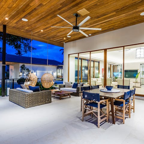 Hang out in the outdoor living area under the pergola for evening cocktails