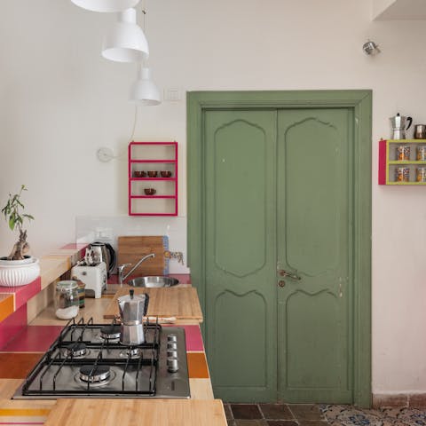 Make your morning espresso in the colourful kitchen