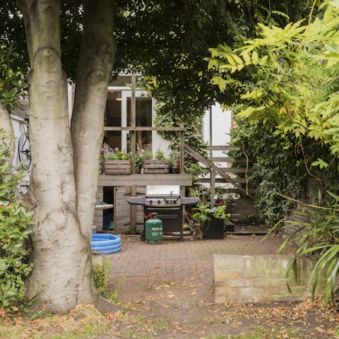 Get some burgers sizzling on the barbecue and dine under the trees
