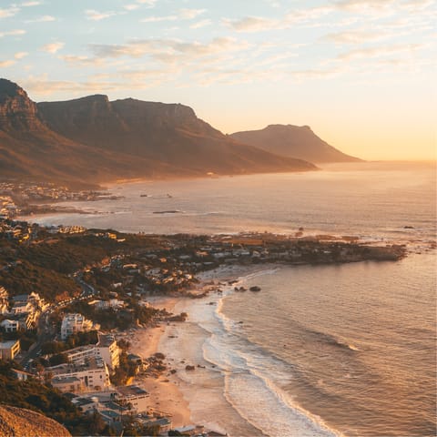 Make the short drive to Camps Bay to watch the sun set