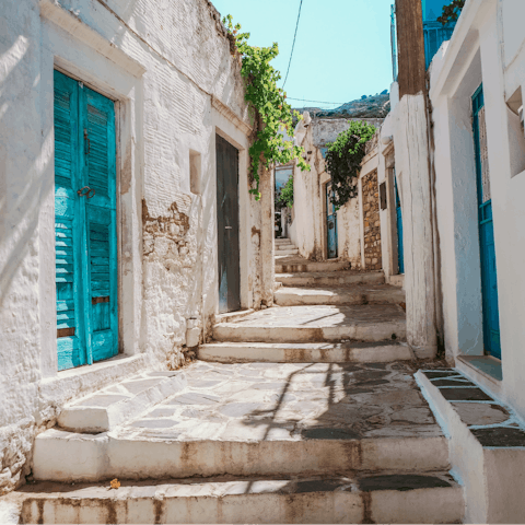 Drive eighteen minutes and explore the cobbled streets of Naxos