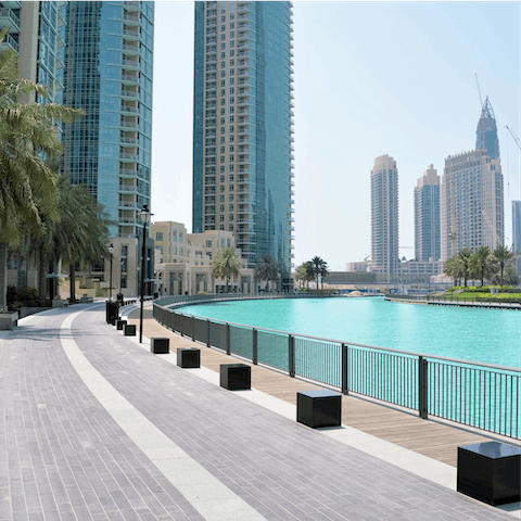 Stroll along Dubai Marina Walk as the sun warms your skin