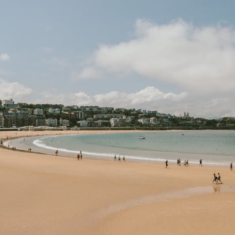 Spend time relaxing on Playa de la Concha, just an eight-minute stroll from your apartment