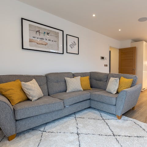 Cosy up for family film nights – the underfloor heating will keep things toasty