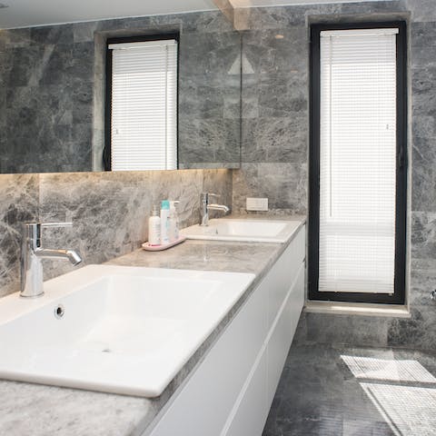 The sleek marble bathrooms provide modern comfort