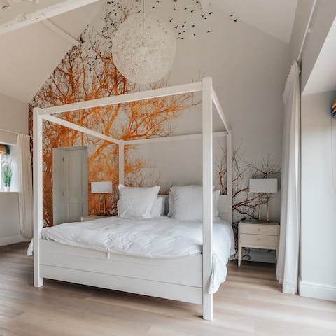 Marvel at the woodland mural in the vaulted master bedroom