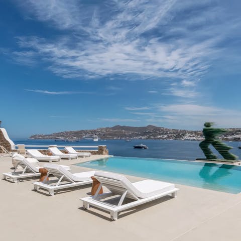 Relax by the private pool with great views of Mykonos' bay