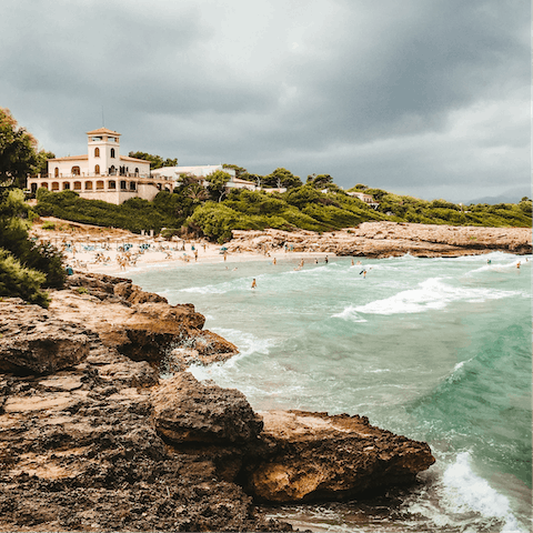 Spend the day on the white sands of Bahia d'Alcúdia, a fifteen-minute drive away