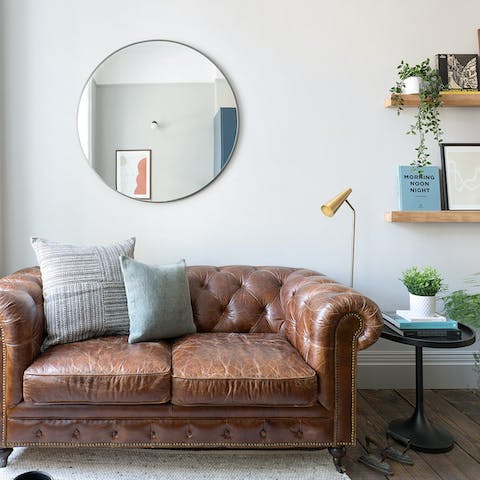 Get comfy on the living room's leather sofa