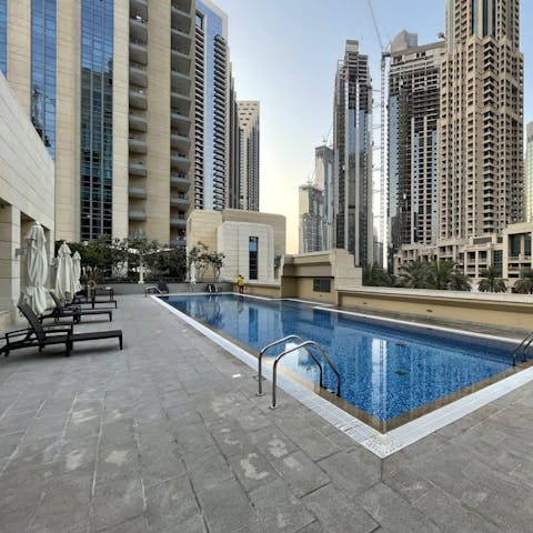 Spend warm days relaxing by the pool, soaking in the cityscape surroundings, and taking dips to cool off