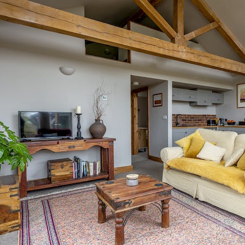 Admire the exposed beam and vaulted ceiling of the beautifully converted barn