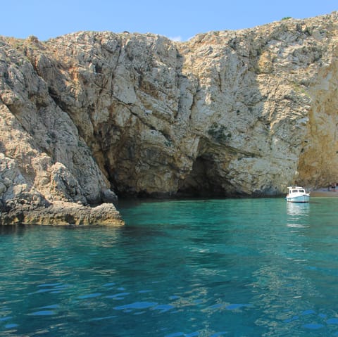 Explore the island of Krk and its beach resorts, charming villages, and rugged landscape