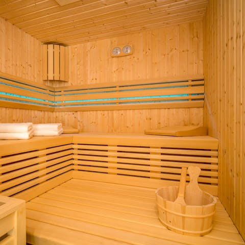 Find total relaxation in the chic sauna, melting away any thoughts of the daily grind