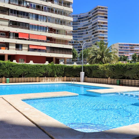 Take a refreshing dip in the glistening communal pool 