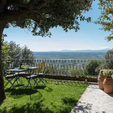 Enjoy a glass of wine at sunset in the garden while taking in wide-sweeping views over the Tuscan hills