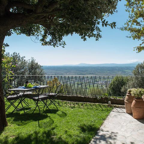 Enjoy a glass of wine at sunset in the garden while taking in wide-sweeping views over the Tuscan hills