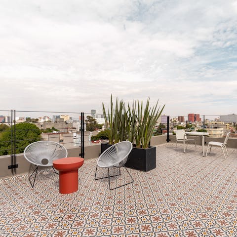 Head up to the shared rooftop terrace for morning coffee with a view