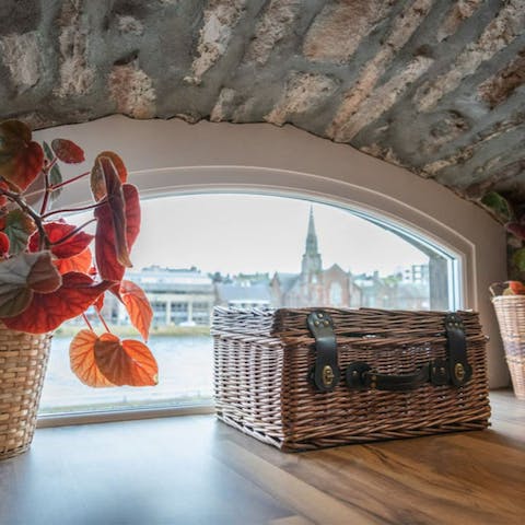 Look out over the River Ness and the city skyline through the quirky floor-level windows