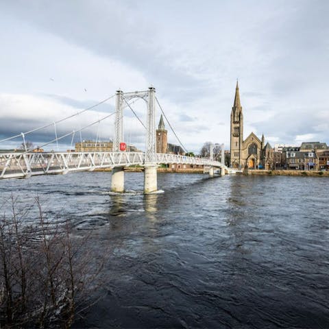 Cross over the iconic Greig Street Bridge to explore the centre of Inverness