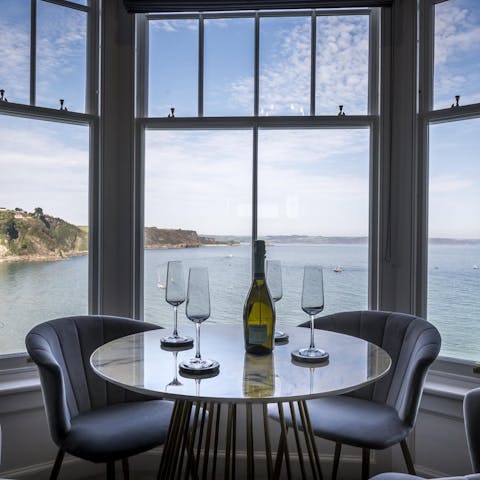 Sip your sundowner in the bay window with the stunning sea view