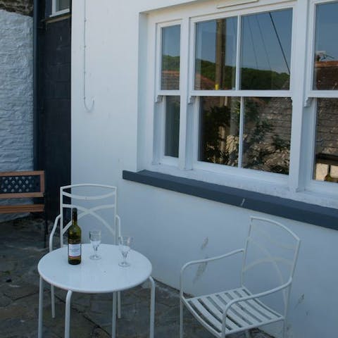 Pop open a bottle of fizz and relax on the patio at sundown