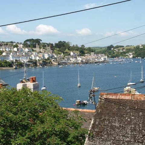 Watch the fishing boats bob on the calm waves from your living room window