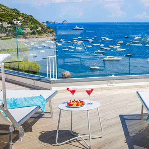 Mix yourself a cocktail and catch some rays on the terrace