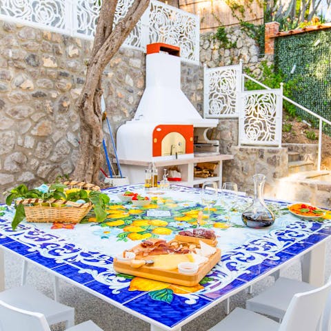 Get creative in the outdoor kitchen and tuck into Italian delicacies alfresco 