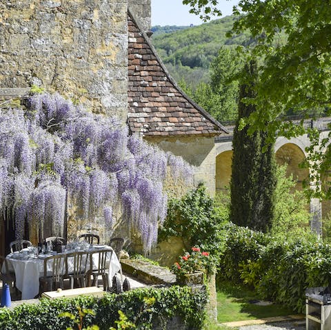 Take a break from formal dining and serve a barbecue beneath the enchanting wisteria