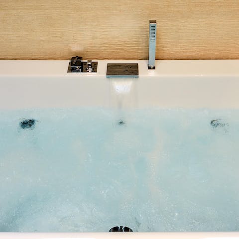 Treat yourself to a long soak in the Jacuzzi bathtub