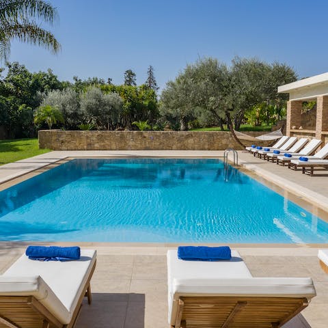 Spend your days in and around your pristine private pool