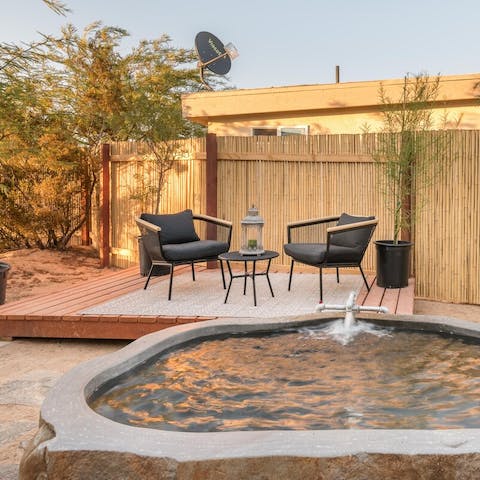 Relax your body with a soak in the private hot springs tub