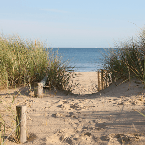 Sink your feet into the sand at West Wittering beach, a short drive away