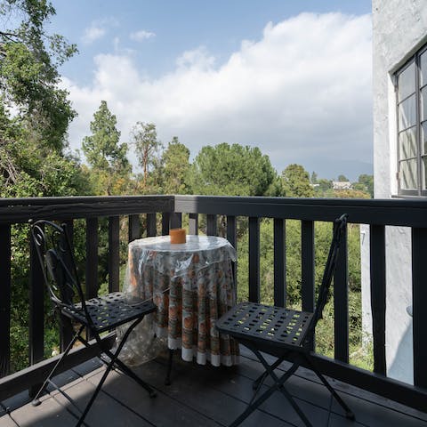 Enjoy your morning coffee while gazing out at the leafy green views from the balcony